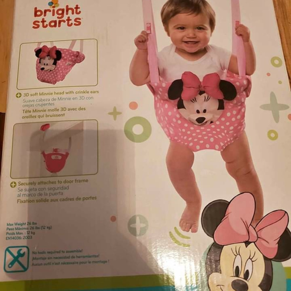 Baby jumper that hangs on chair. And a baby bed to